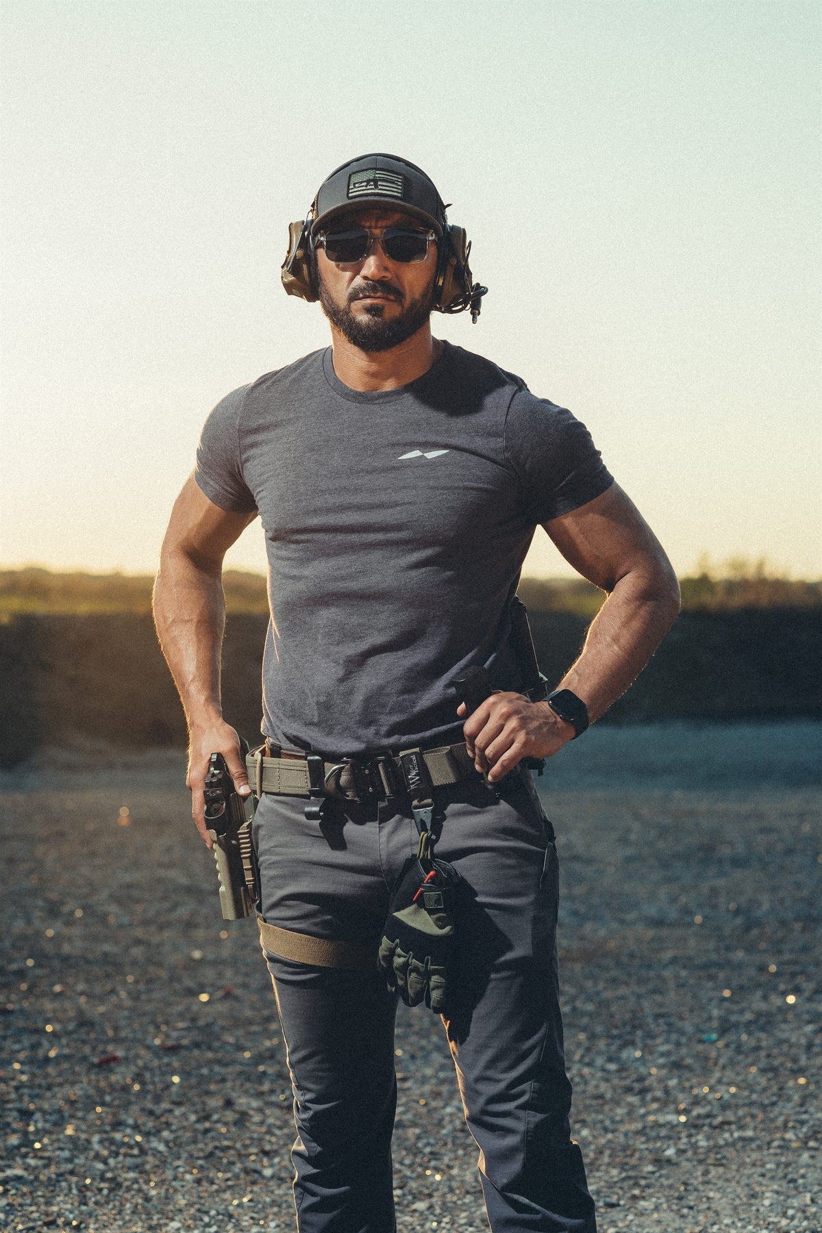 Kawa at the range at sunset, pistol belt, holster and ear protection